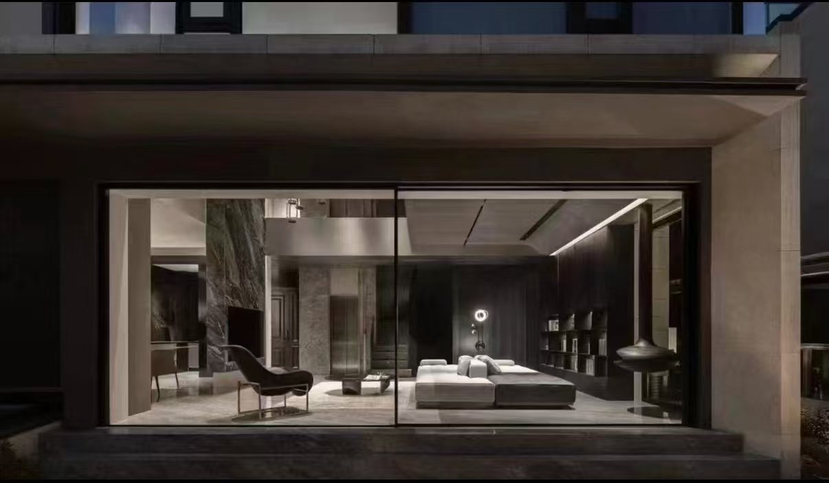 ABTE panoramic aluminum sliding door in a luxury residence at night
